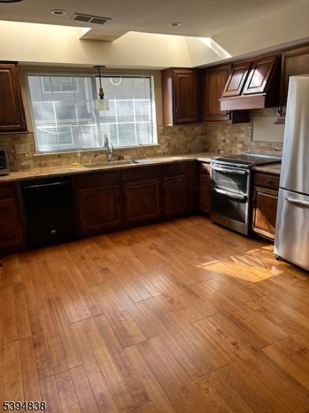 17 Crestmont Road Bedminster, NJ 07921 - Photo 6 of 20 a kitchen with stainless steel appliances granite countertop a sink and a stove