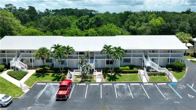 an aerial view of a house with swimming pool garden and patio