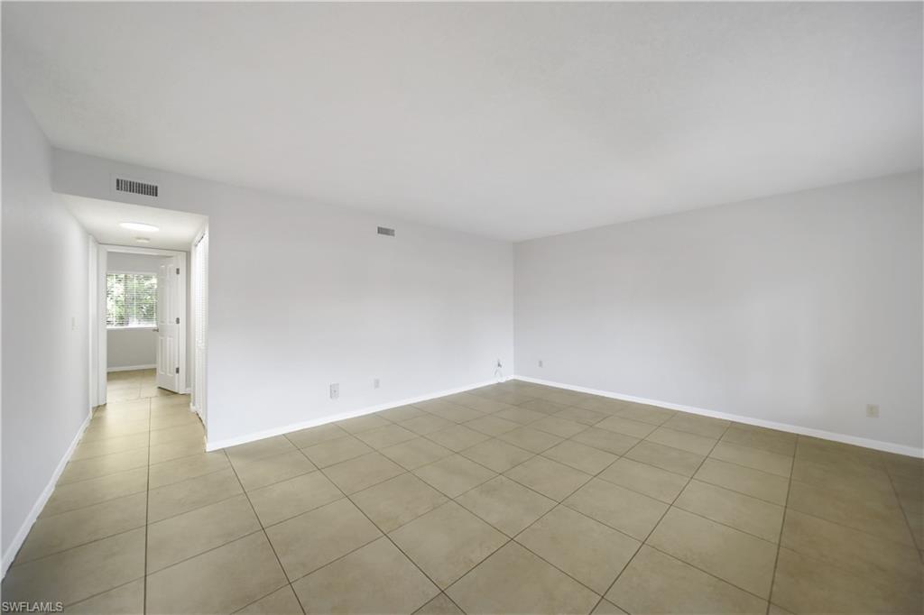 4621 Bayshore Drive, Unit Q4 Naples, FL 34112 - Photo 3 of 12 wooden floor in a room