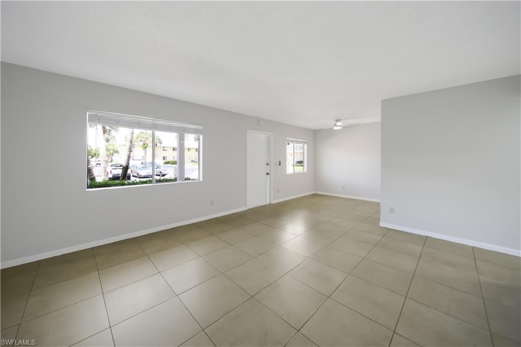 4621 Bayshore Drive, Unit Q4 Naples, FL 34112 - Photo 4 of 12 a view of an empty room with a window