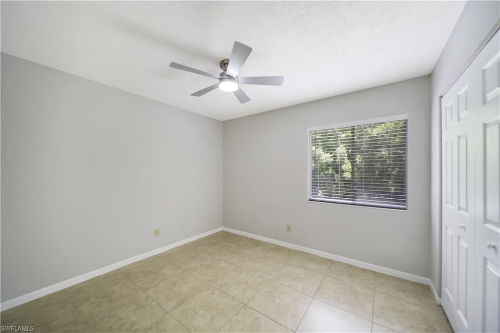 4621 Bayshore Drive, Unit Q4 Naples, FL 34112 - Photo 10 of 12 a view of an empty room with a window
