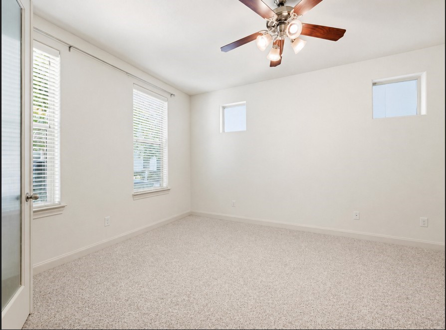 9427 London Bridge Station Houston, TX 77045 - Photo 5 of 30 Experience the allure of this 1st floor bedroom, featuring charming double doors that invite you into a bright and welcoming space.
