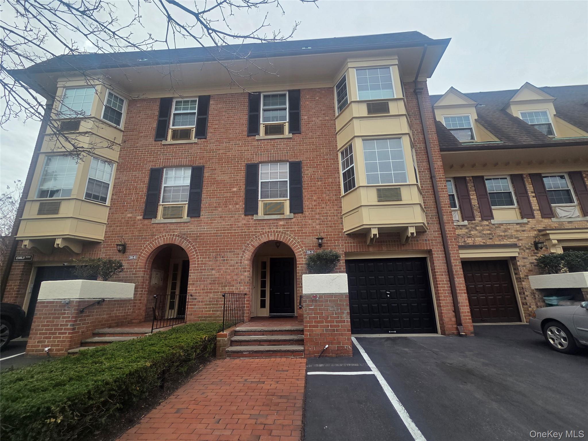 a view of a brick building with many windows