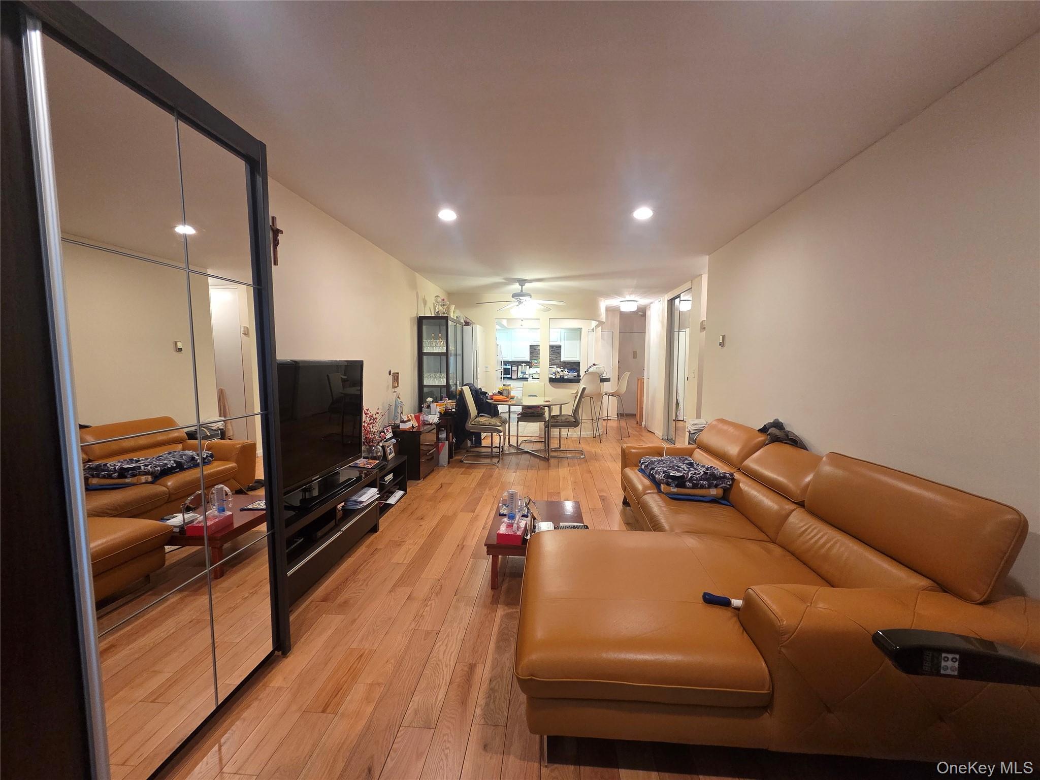 206-14 Emily Road, Unit 42L Queens, NY 11360 - Photo 1 of 9 a room with furniture pool table flat screen tv and windows