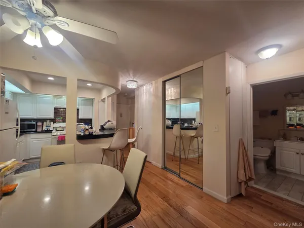 a view of a dining room with furniture and wooden floor