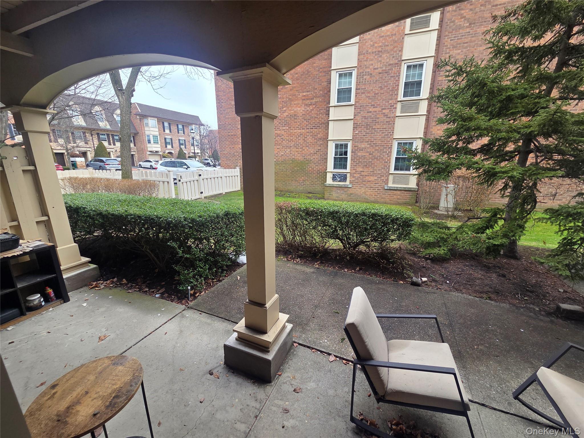 206-14 Emily Road, Unit 42L Queens, NY 11360 - Photo 8 of 9 a view of swimming pool with outdoor seating and a garden