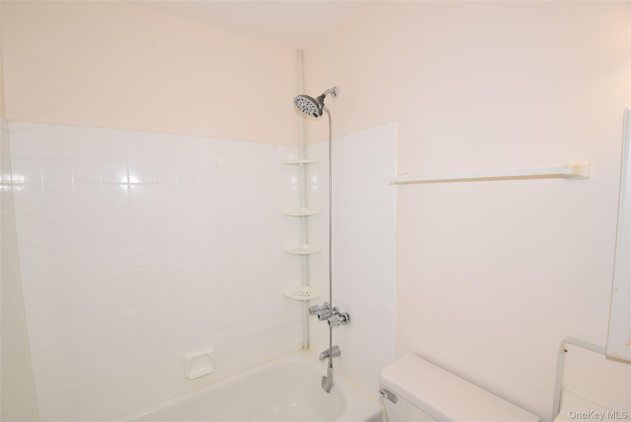 206-14 Emily Road, Unit 42L Queens, NY 11360 - Photo 10 of 14 a bathroom with a shower