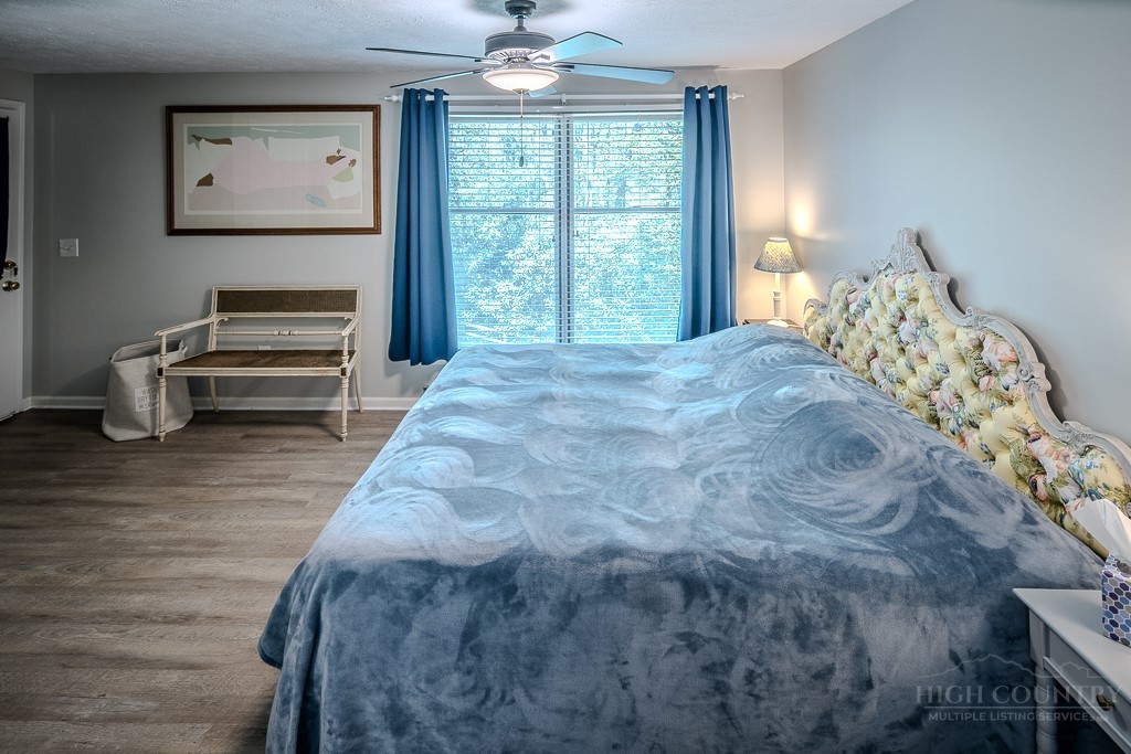 38 Rocky Meadows Road Newland, NC 28657 - Photo 15 of 50 a bedroom with a bed and a window