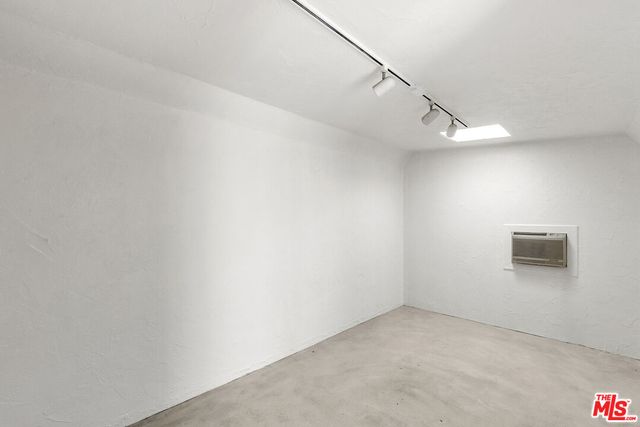 a view of a hallway with stairs