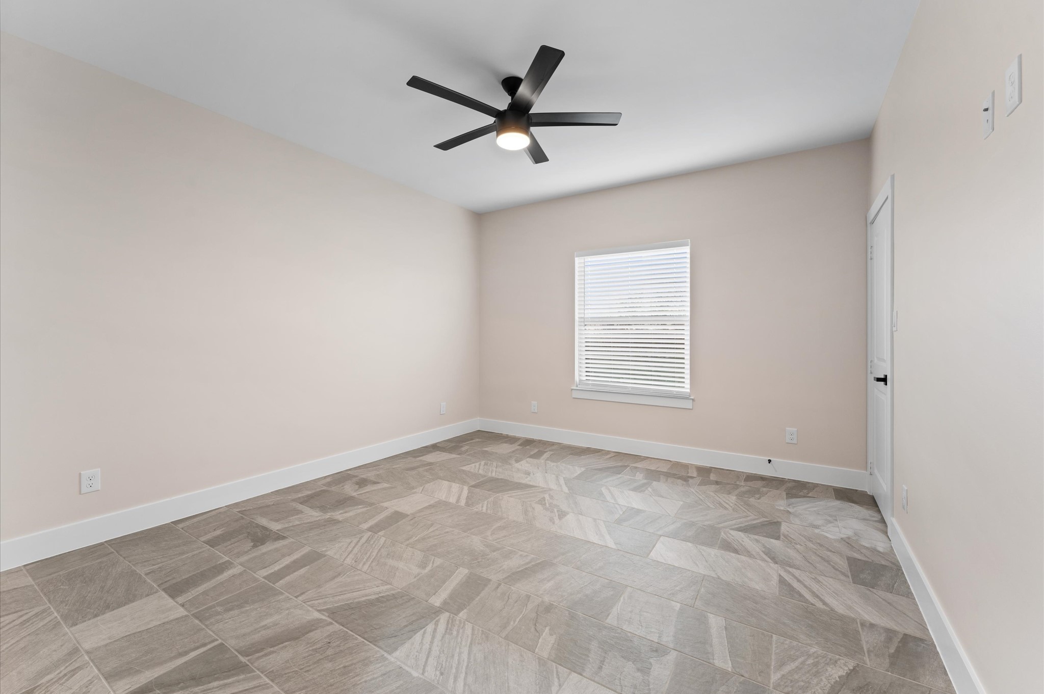 1908 Dismuke Street, Unit A Houston, TX 77023 - Photo 26 of 42 an empty room with a ceiling fan and window
