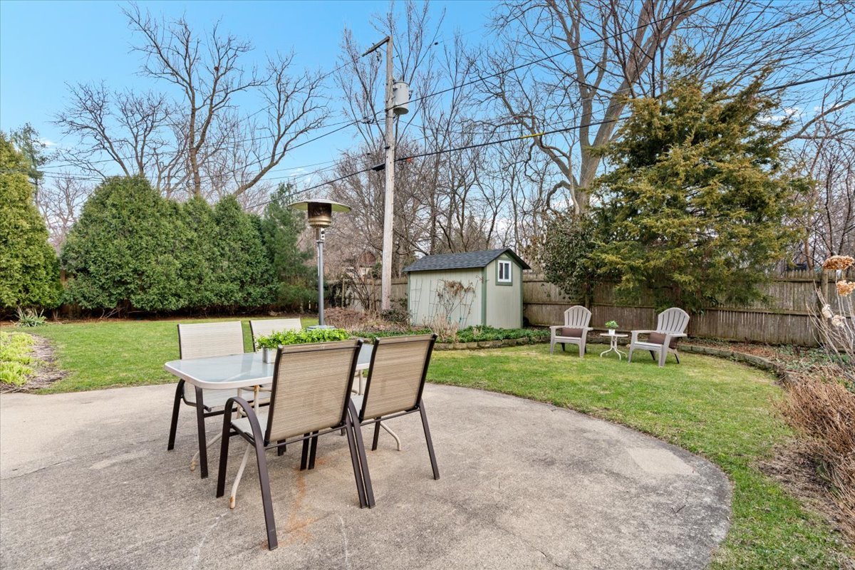 320 Beverly Drive Wilmette, IL 60091 - Photo 12 of 38 a view of a chairs and table in backyard of the house