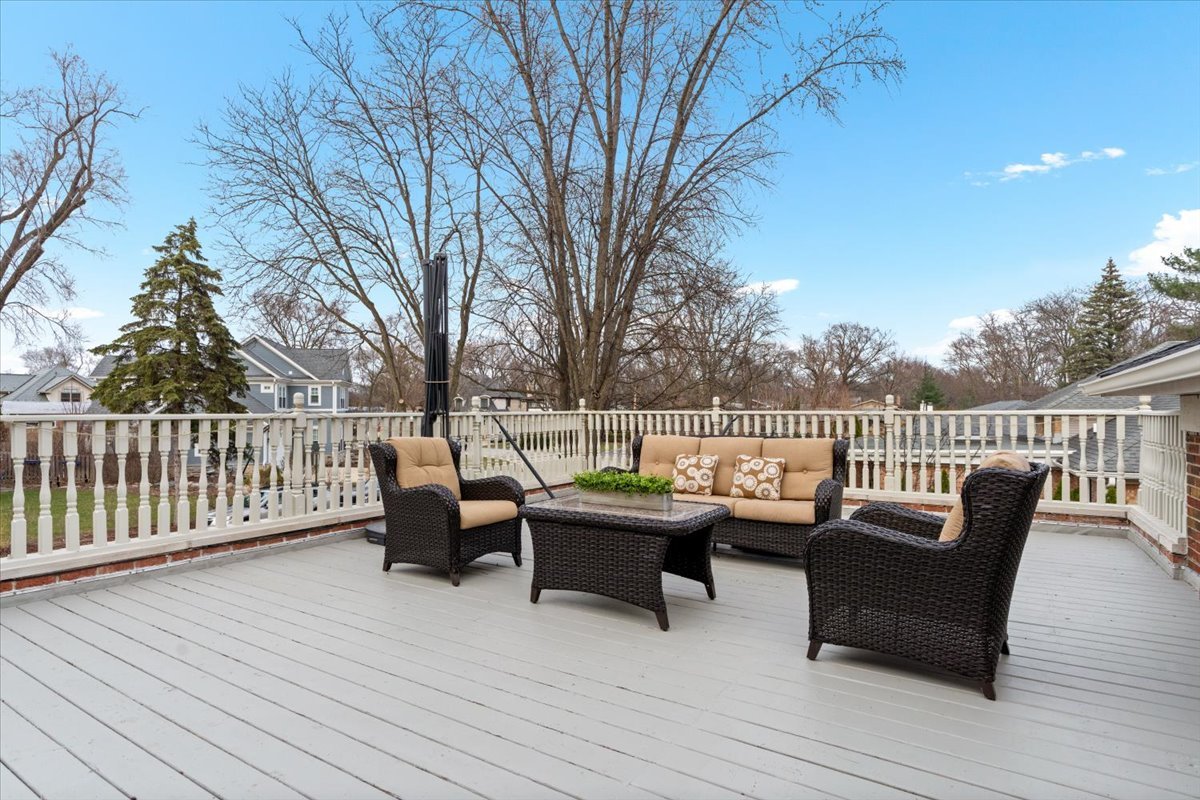 320 Beverly Drive Wilmette, IL 60091 - Photo 15 of 38 a roof deck with couches and wooden fence