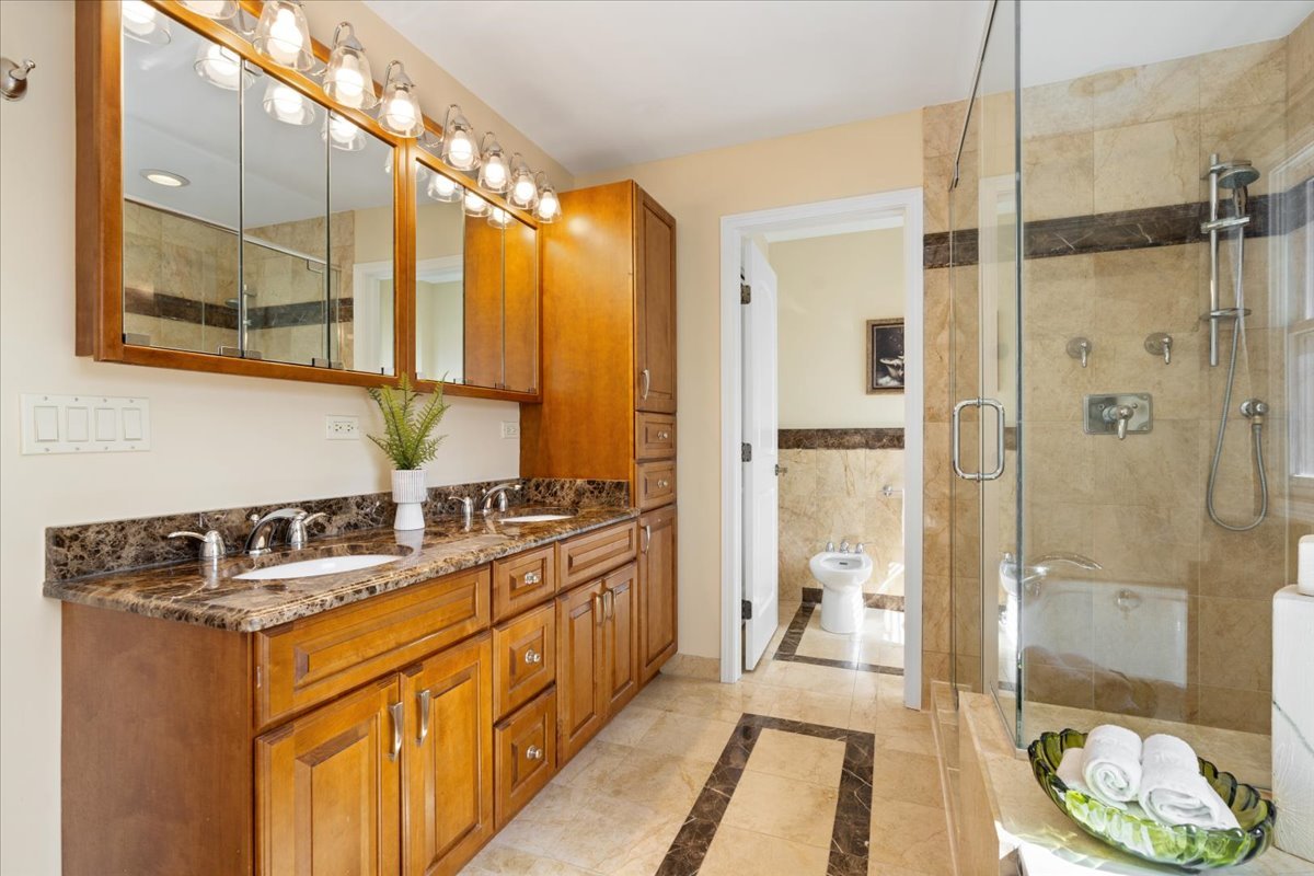 320 Beverly Drive Wilmette, IL 60091 - Photo 20 of 38 a bathroom with a double vanity sink mirror and shower