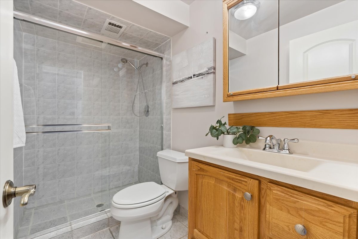 320 Beverly Drive Wilmette, IL 60091 - Photo 31 of 38 a bathroom with a sink toilet and shower