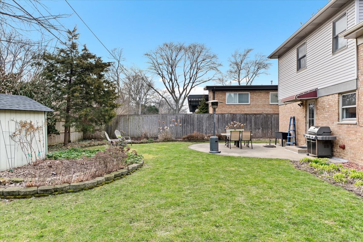 320 Beverly Drive Wilmette, IL 60091 - Photo 34 of 38 a view of a house with backyard and sitting area