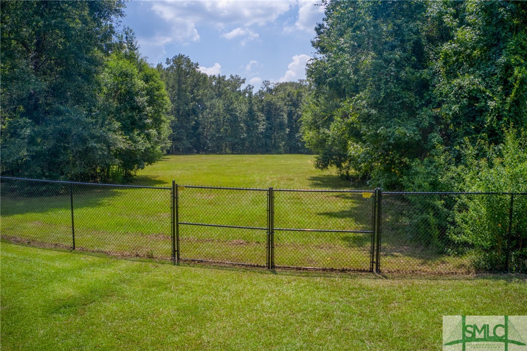 45 Perry Road Bloomingdale, GA 31302 - Photo 5 of 44 Front part of property is fenced with new 6' fence