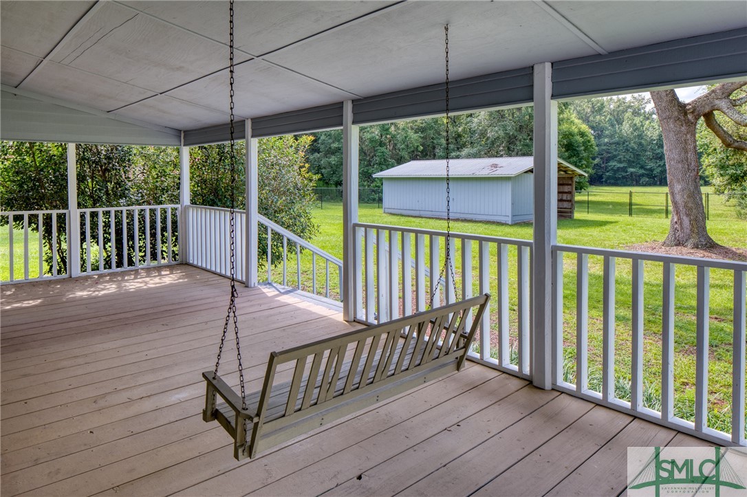 45 Perry Road Bloomingdale, GA 31302 - Photo 8 of 44 Extra deep covered porch with swing