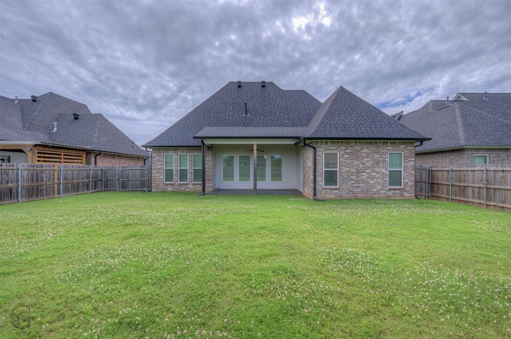 605 Meridian Way Benton, LA 71006 - Photo 27 of 29 Expansive grassy backyard featuring a full privacy fence
