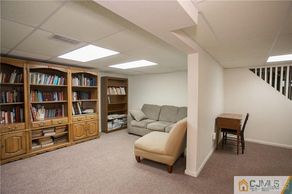 1 Moraine Road Edison, NJ 08820 - Photo 28 of 30 a living room with furniture cabinets and a book shelf