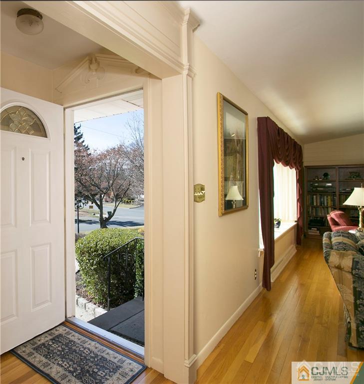1 Moraine Road Edison, NJ 08820 - Photo 8 of 30 a view of a hallway view with wooden floor and furniture