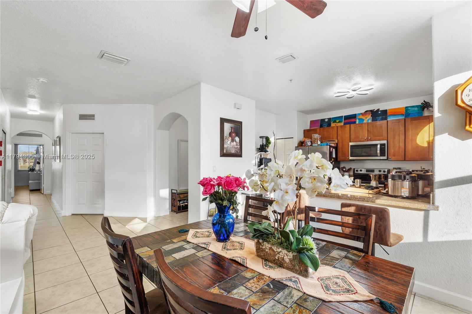 10012 Northwest 7th Street, Unit 107 Miami, FL 33172 - Photo 11 of 44 a living room with furniture and wooden floor