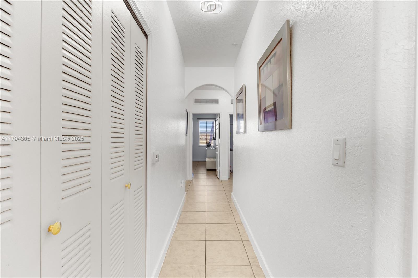 10012 Northwest 7th Street, Unit 107 Miami, FL 33172 - Photo 20 of 44 a view of a hallway with wooden floor