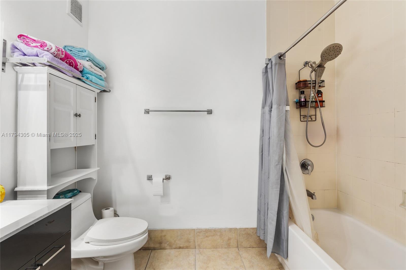10012 Northwest 7th Street, Unit 107 Miami, FL 33172 - Photo 22 of 44 a bathroom with a sink toilet and shower