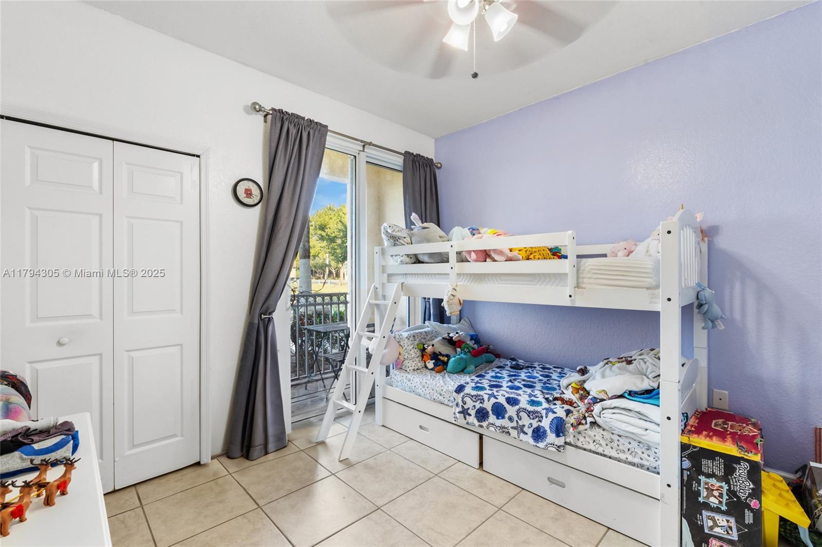 10012 Northwest 7th Street, Unit 107 Miami, FL 33172 - Photo 24 of 44 a bedroom with a bed and a window