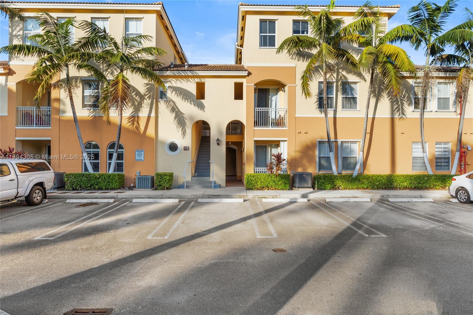 10012 Northwest 7th Street, Unit 107 Miami, FL 33172 - Photo 4 of 44 front view of a building with a street