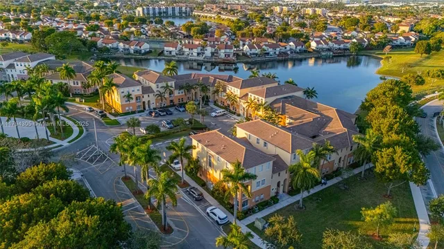 an aerial view of a house with a garden and swimming pool