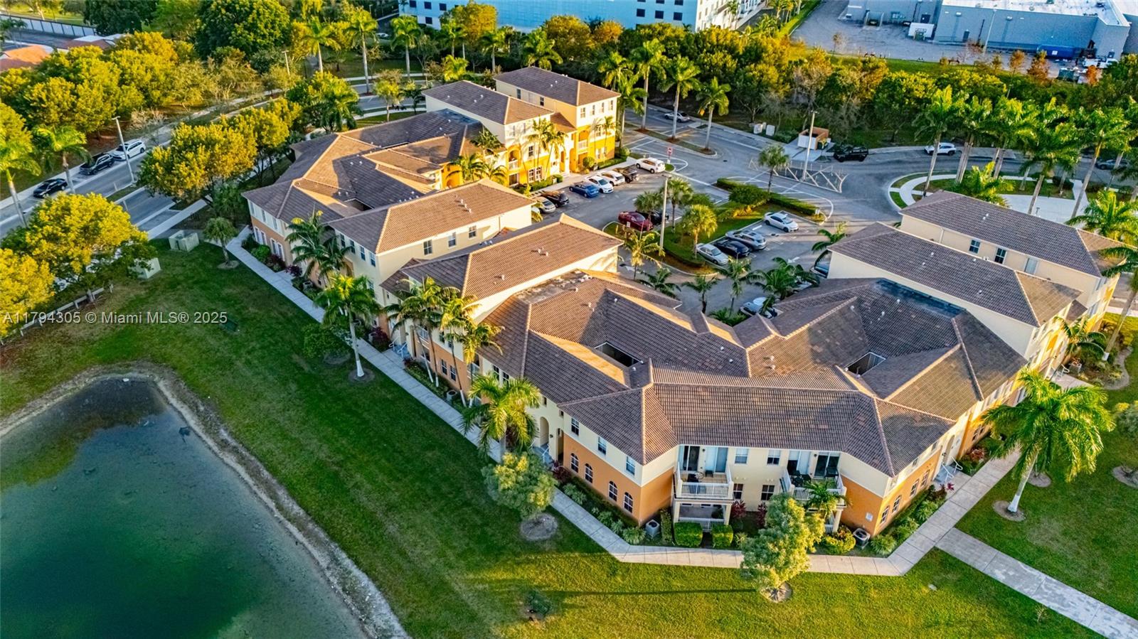 10012 Northwest 7th Street, Unit 107 Miami, FL 33172 - Photo 44 of 44 an aerial view of a house with a garden and swimming pool