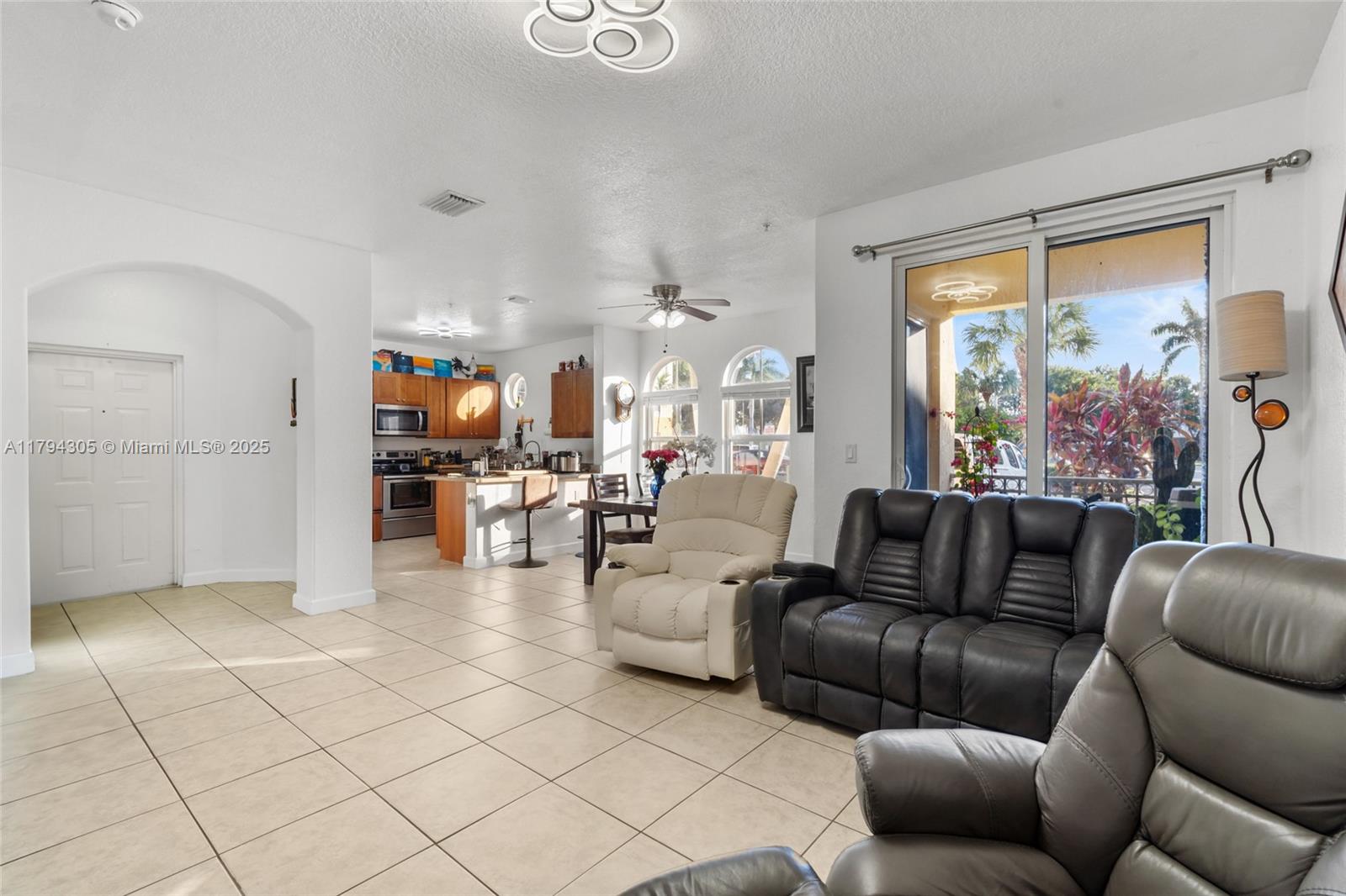 10012 Northwest 7th Street, Unit 107 Miami, FL 33172 - Photo 8 of 44 a living room with furniture and a large window