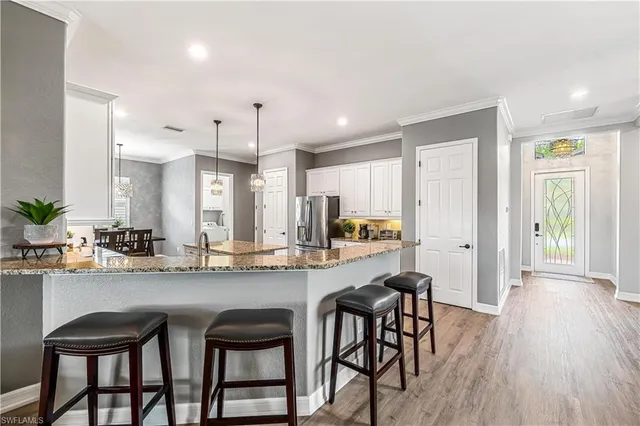 a kitchen with a table and chairs in it