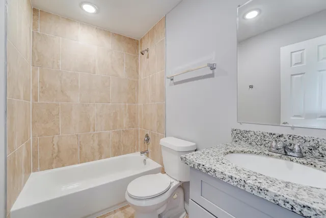 a bathroom with a sink a toilet and a bathtub