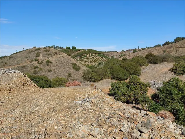 a view of a snow with a mountain in the background