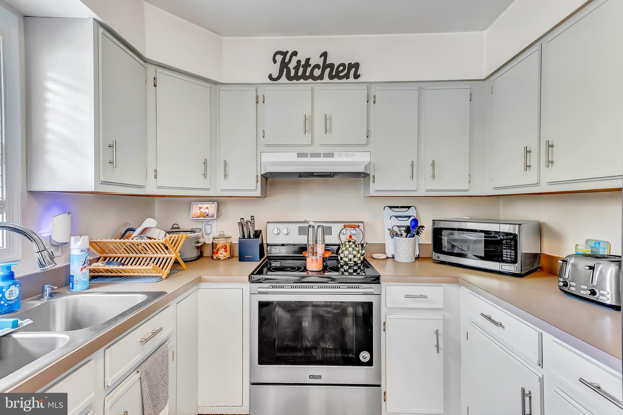 4925 Campground Road Eden, MD 21822 - Photo 8 of 42 a kitchen with stainless steel appliances granite countertop a sink a stove and cabinets