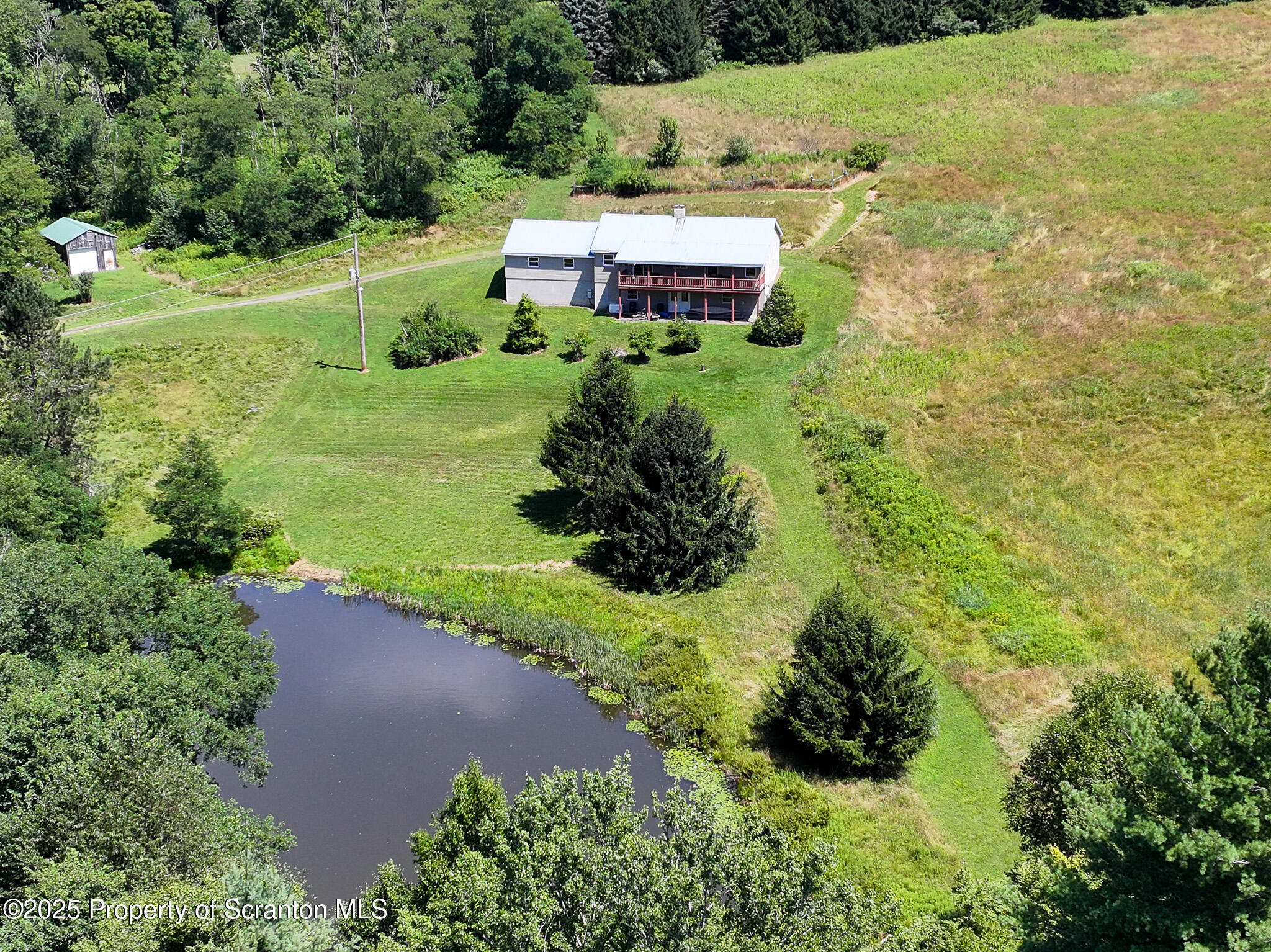 5290 Irish Hill Road Montrose, PA 18801 - Photo 54 of 67 an aerial view of a house with a yard