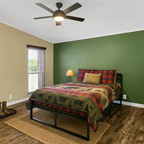 a bedroom with a bed and window