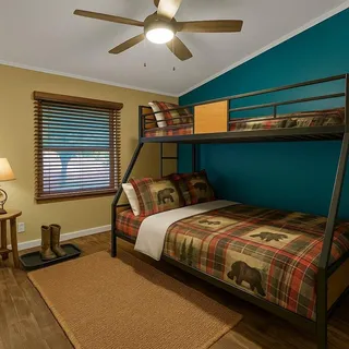 a bedroom with a bed and window