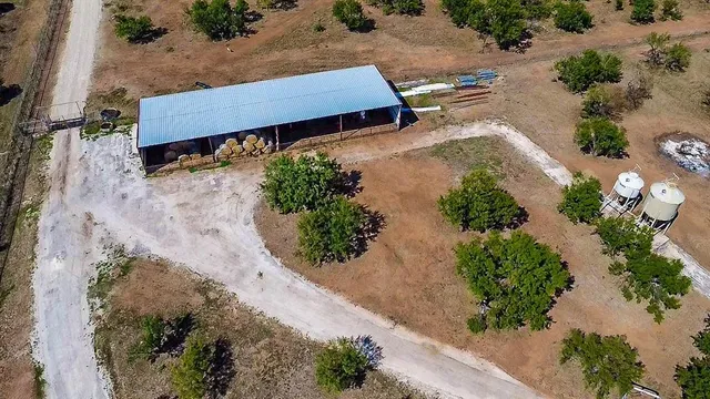 an aerial view of a yard with a lake view