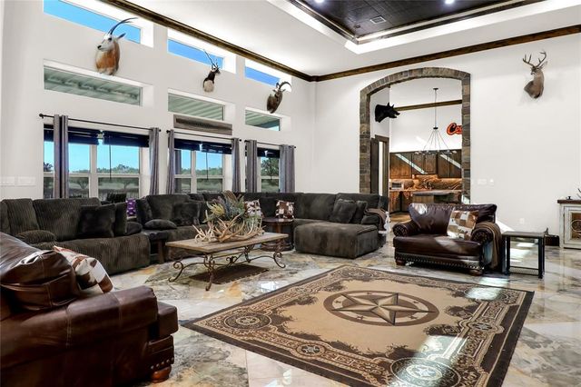 a living room with furniture and a rug