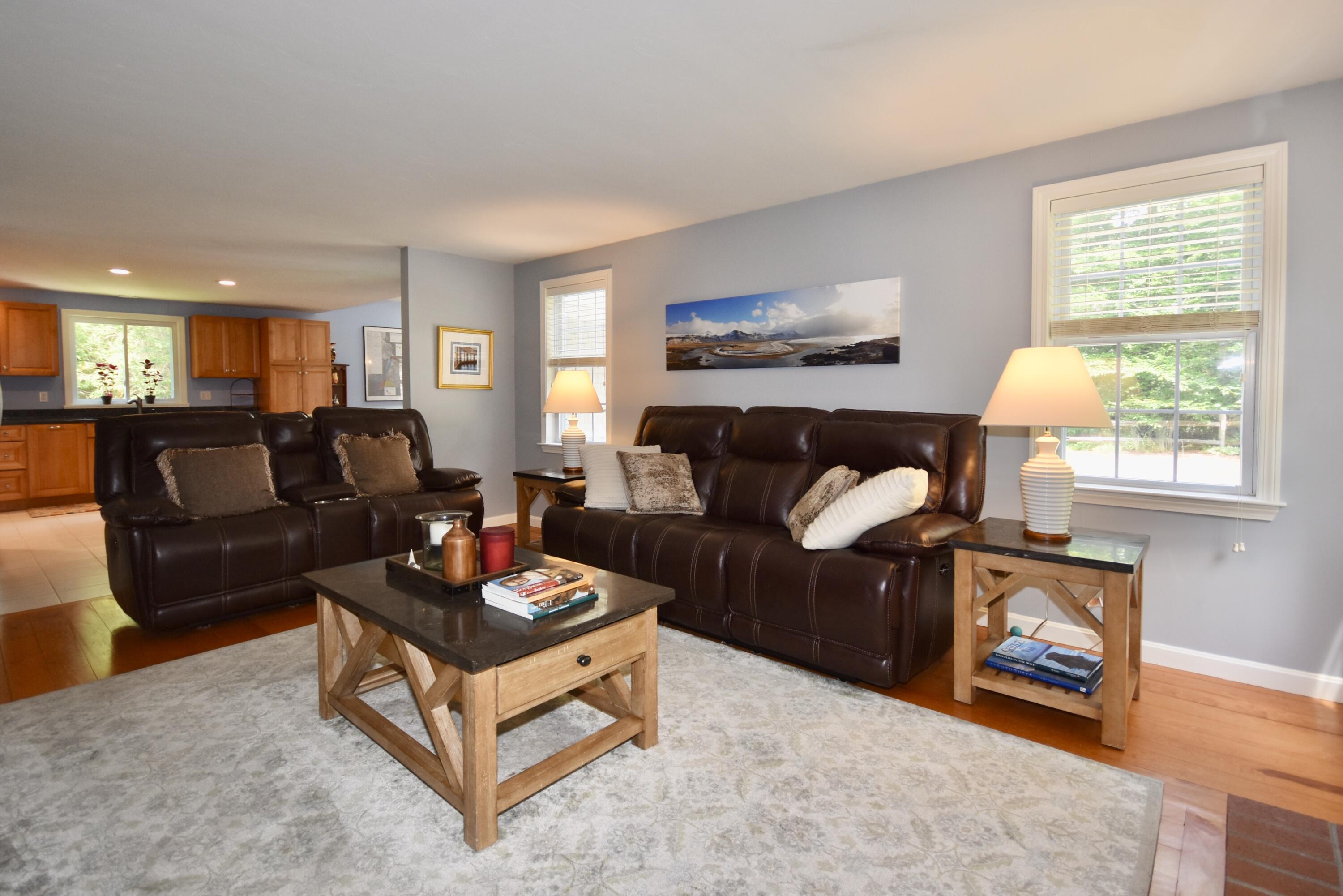 33 Asa Meiggs Road Sandwich, MA 02563 - Photo 17 of 34 a living room with furniture and a fireplace