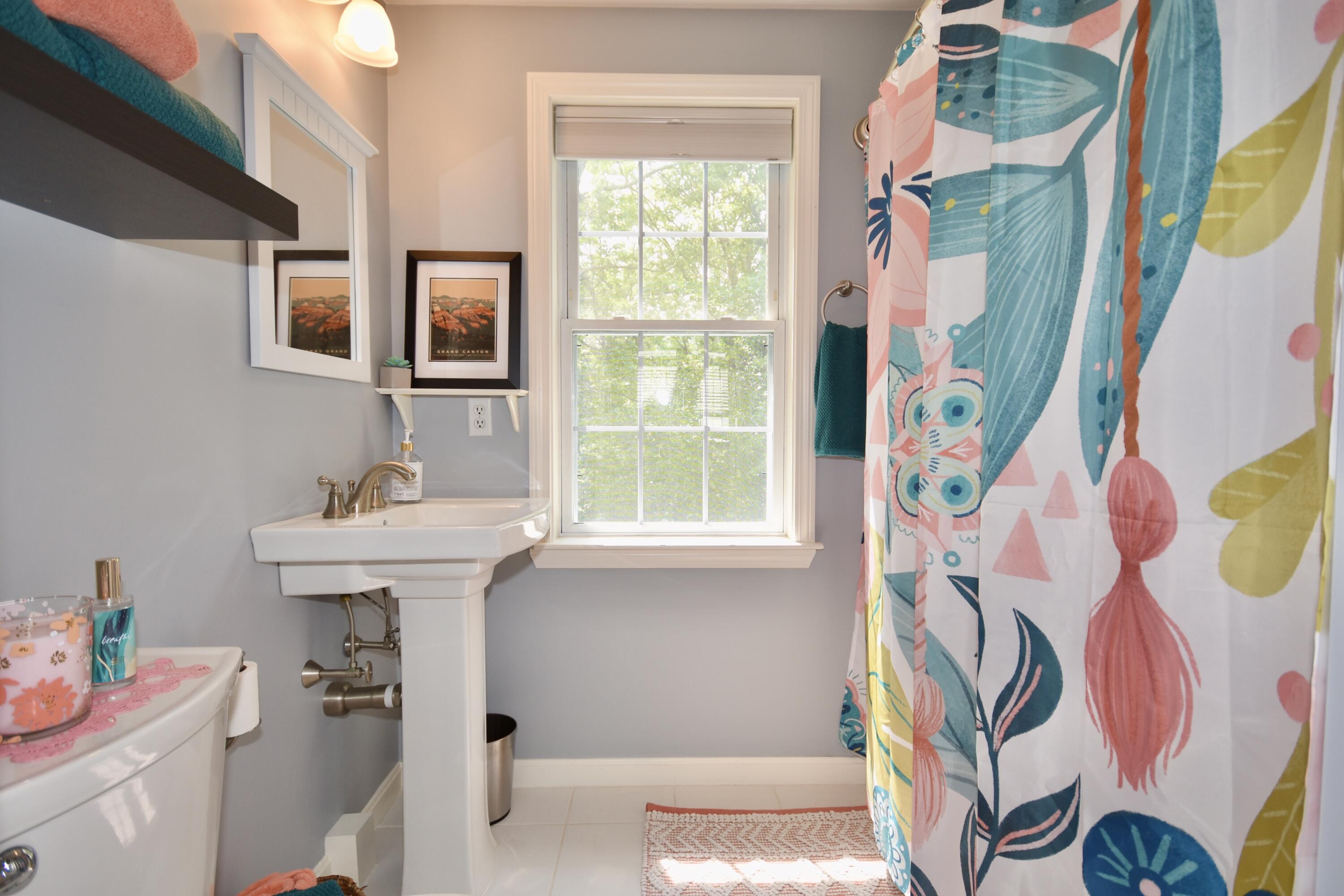 33 Asa Meiggs Road Sandwich, MA 02563 - Photo 30 of 34 a bathroom with a sink a vanity and a mirror