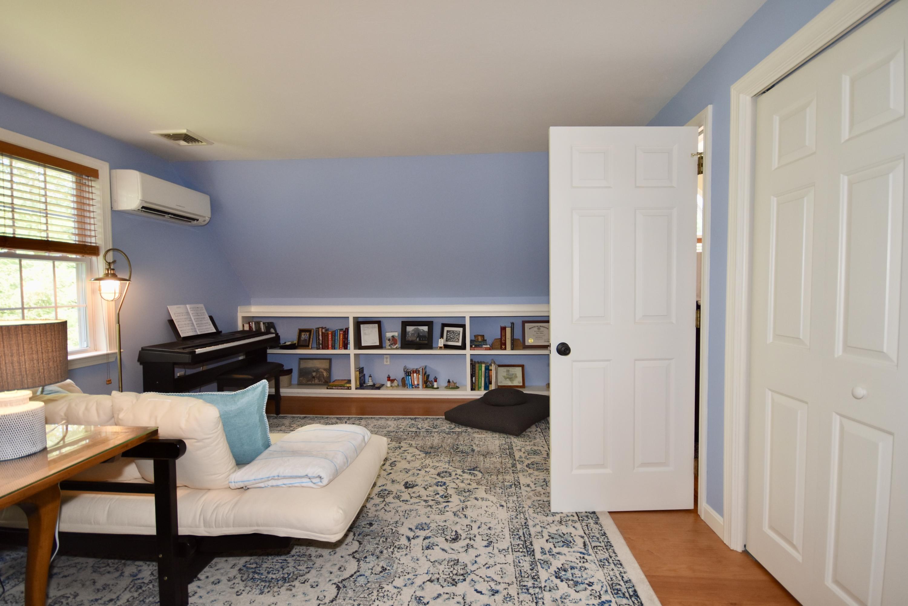 33 Asa Meiggs Road Sandwich, MA 02563 - Photo 34 of 34 a living room with furniture and a rug