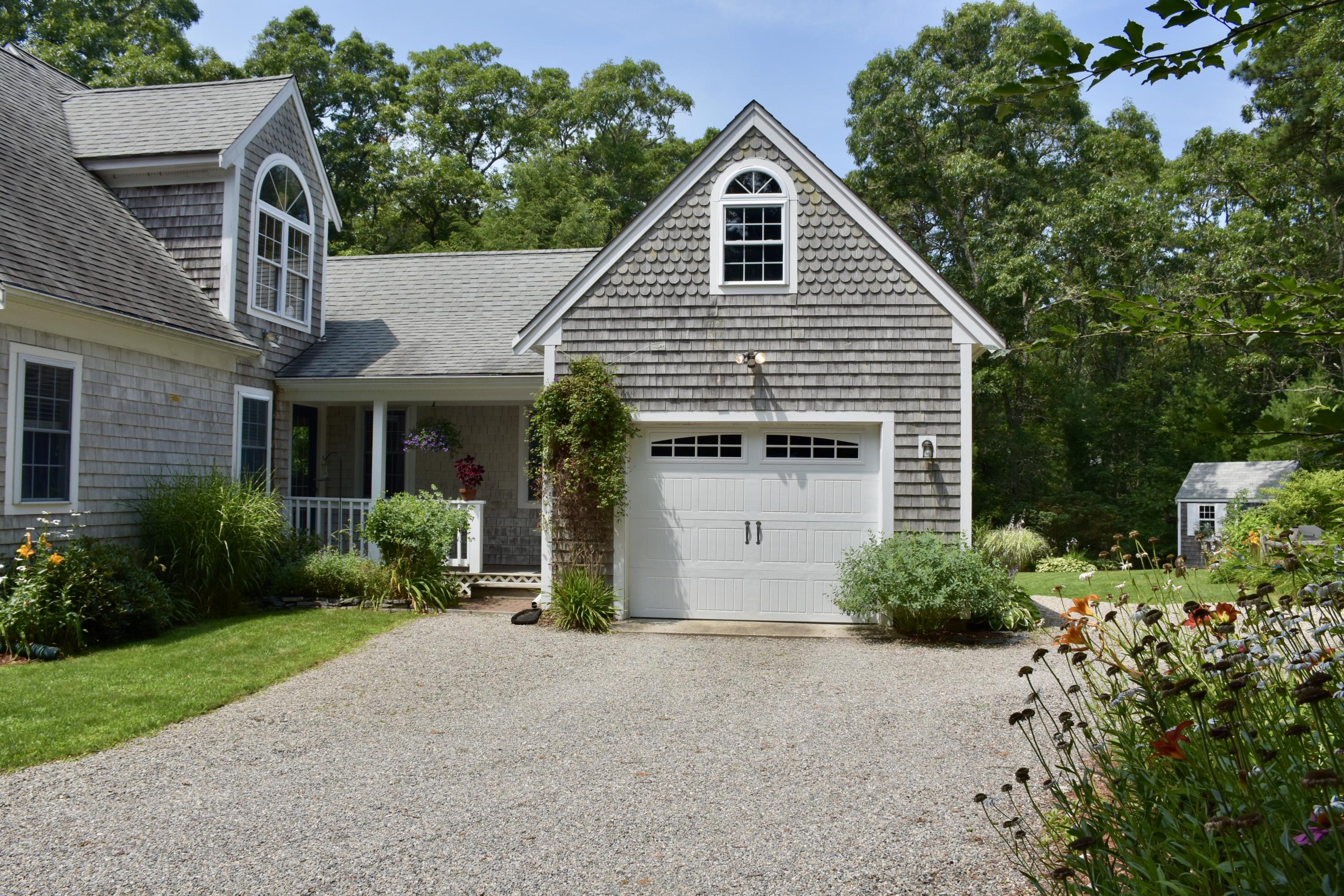 33 Asa Meiggs Road Sandwich, MA 02563 - Photo 4 of 34 a front view of a house with garden