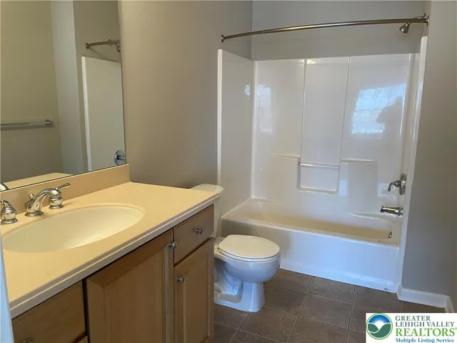 a view of a chairs and table in the patio