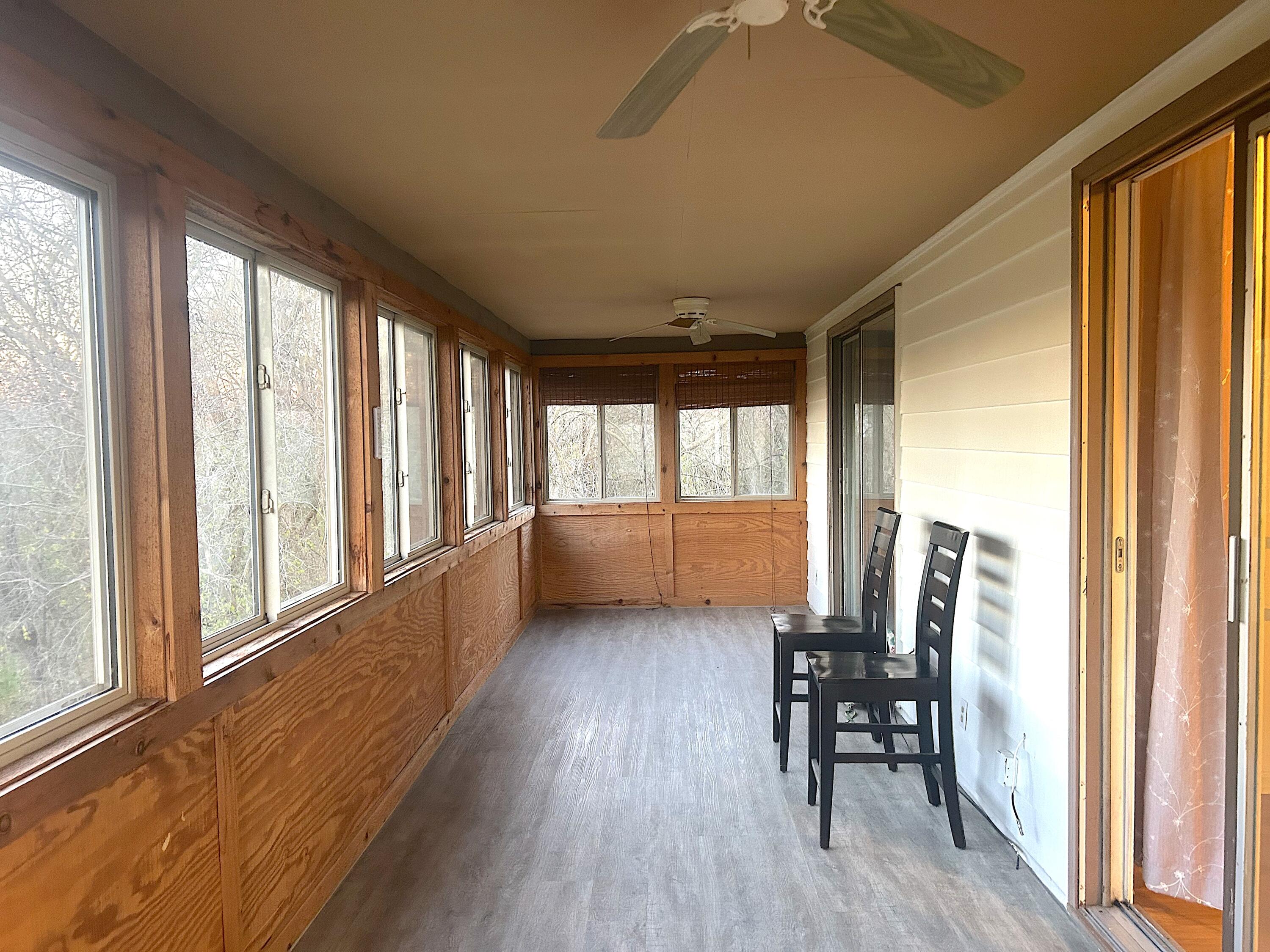280 County Road B Fontana, WI 53125 - Photo 14 of 15 The Enclosed Porch is accessed from The Primary Bedroom and Living Room.