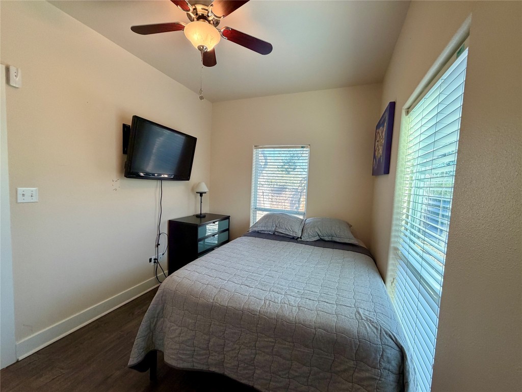 5503 Hiline Road Austin, TX 78734 - Photo 16 of 20 Bedroom featuring a ceiling fan and wood finished floors
