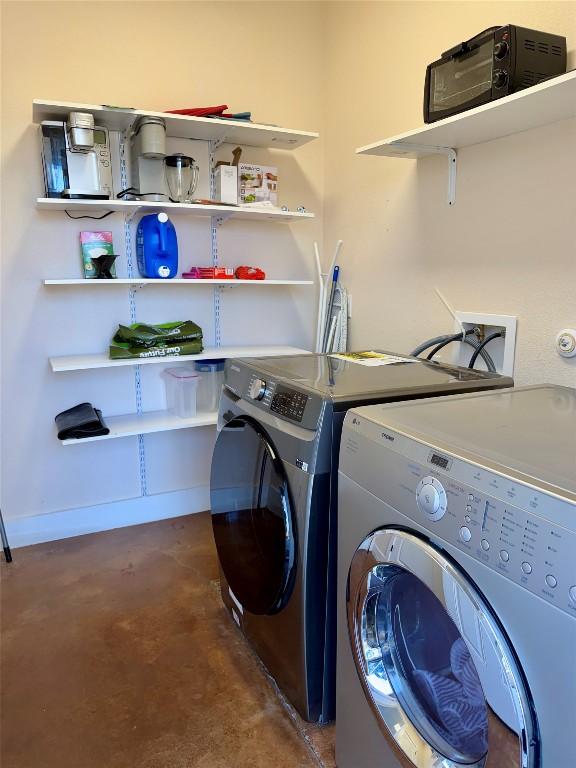 5503 Hiline Road Austin, TX 78734 - Photo 17 of 20 Washroom with concrete floors and separate washer and dryer with storage space