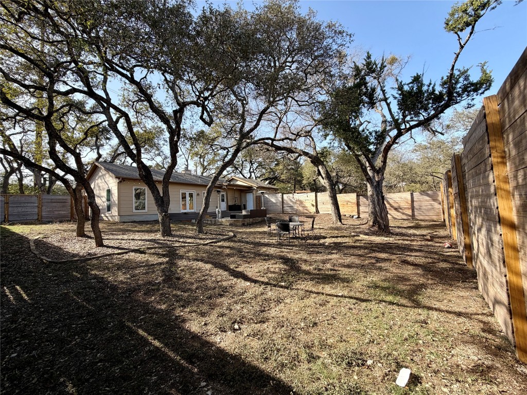 5503 Hiline Road Austin, TX 78734 - Photo 20 of 20 Fenced backyard with a fire pit